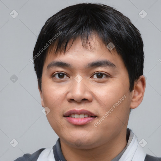 Joyful asian young-adult male with short  black hair and brown eyes