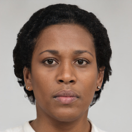 Neutral black young-adult female with short  brown hair and brown eyes