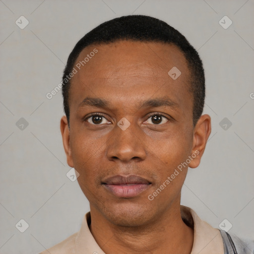 Neutral black young-adult male with short  black hair and brown eyes