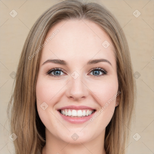 Joyful white young-adult female with long  brown hair and green eyes