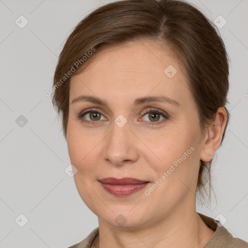 Joyful white adult female with medium  brown hair and grey eyes