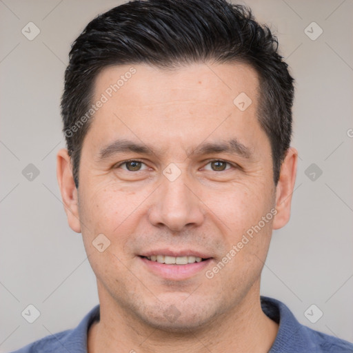 Joyful white adult male with short  brown hair and brown eyes