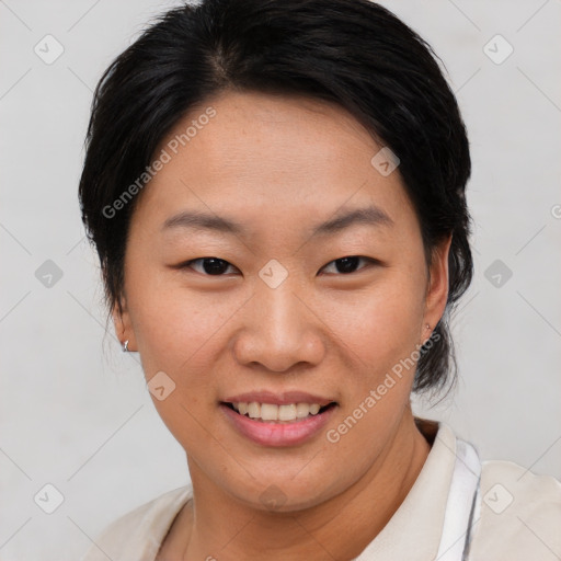 Joyful asian young-adult female with short  brown hair and brown eyes