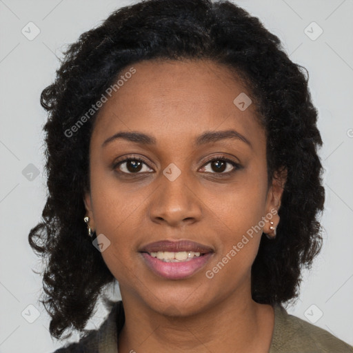 Joyful black young-adult female with long  brown hair and brown eyes