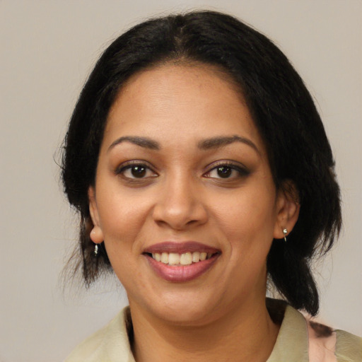 Joyful latino young-adult female with medium  black hair and brown eyes