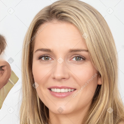 Joyful white young-adult female with long  brown hair and brown eyes