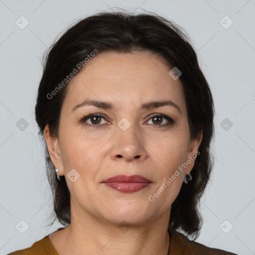 Joyful white adult female with medium  brown hair and brown eyes