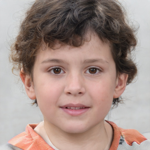 Joyful white child male with medium  brown hair and brown eyes