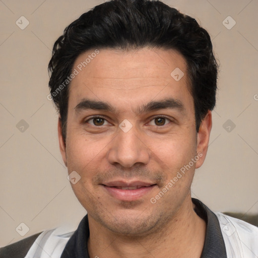 Joyful white adult male with short  black hair and brown eyes