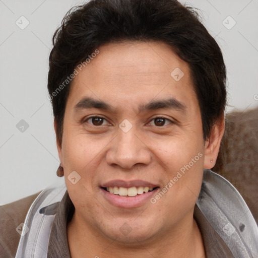 Joyful white adult male with short  brown hair and brown eyes