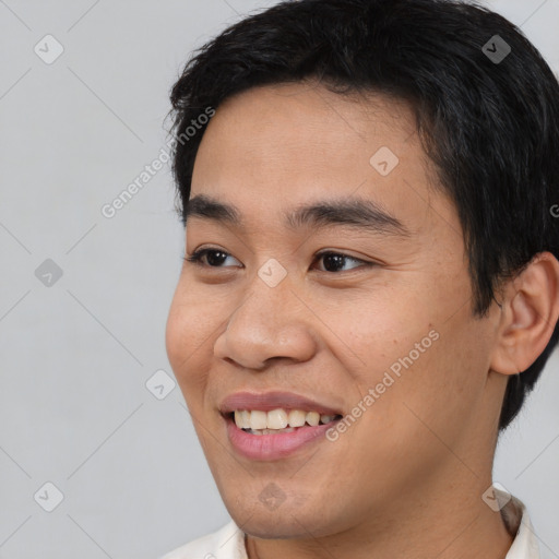 Joyful white young-adult male with short  black hair and brown eyes