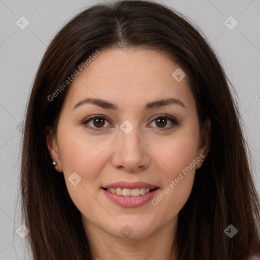 Joyful white young-adult female with long  brown hair and brown eyes