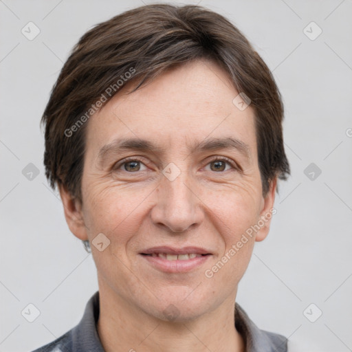 Joyful white adult male with short  brown hair and grey eyes