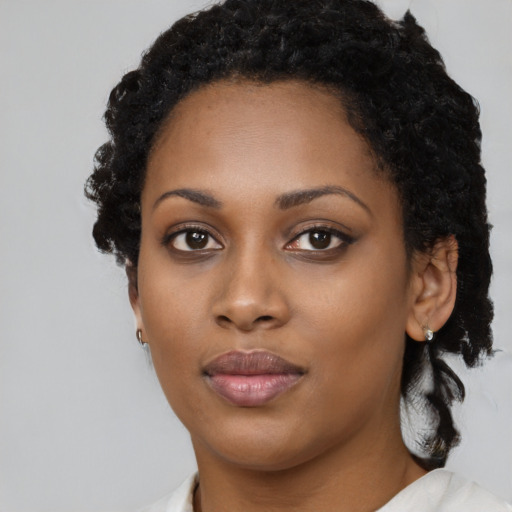 Neutral black young-adult female with medium  black hair and brown eyes