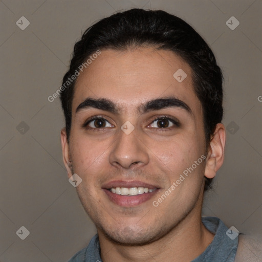 Joyful white young-adult male with short  black hair and brown eyes