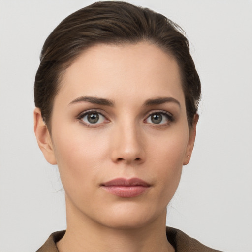 Neutral white young-adult female with short  brown hair and brown eyes