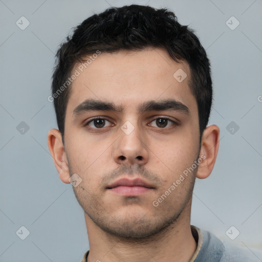 Neutral white young-adult male with short  brown hair and brown eyes