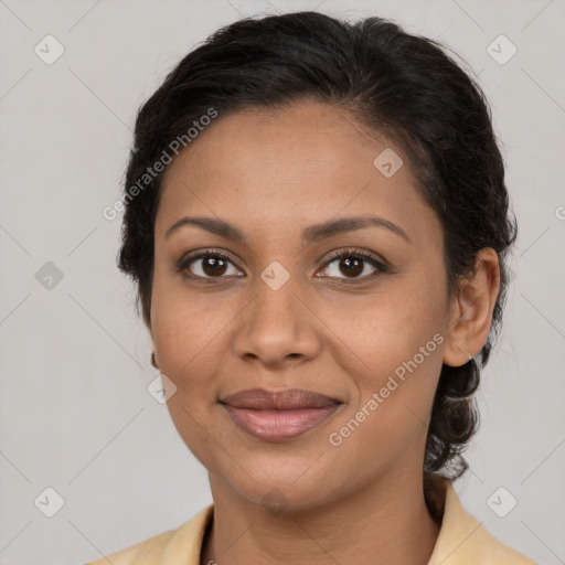 Joyful latino young-adult female with medium  brown hair and brown eyes