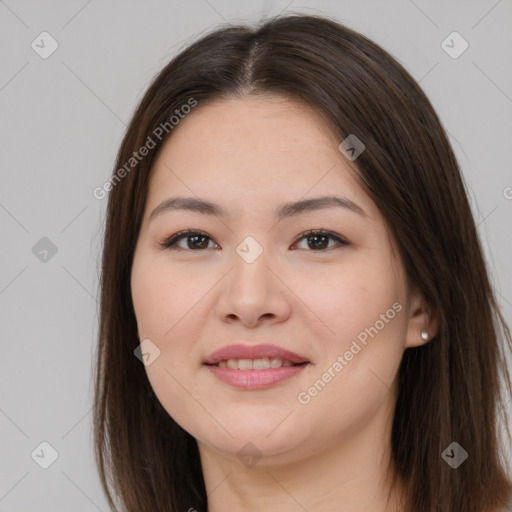 Joyful asian young-adult female with long  brown hair and brown eyes