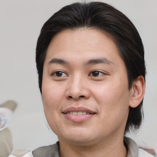 Joyful white young-adult male with medium  brown hair and brown eyes