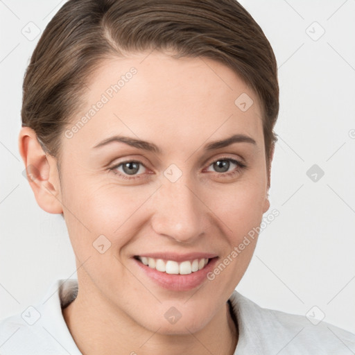 Joyful white young-adult female with short  brown hair and grey eyes