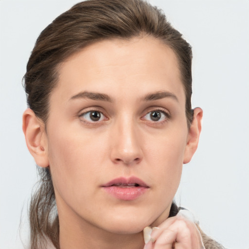 Neutral white young-adult female with short  brown hair and brown eyes