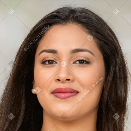 Joyful latino young-adult female with long  brown hair and brown eyes