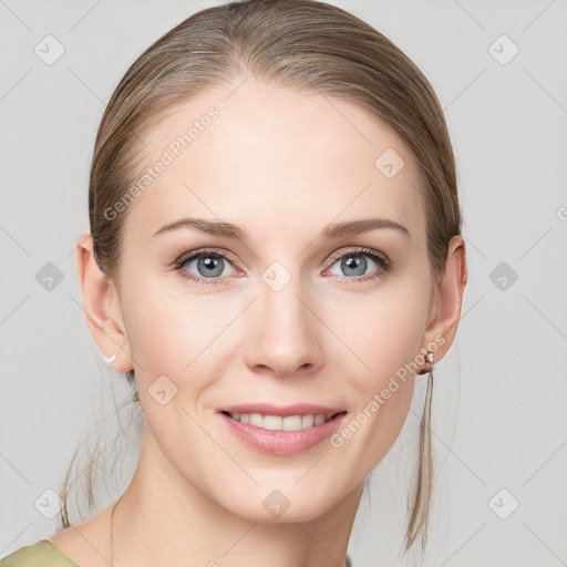 Joyful white young-adult female with medium  brown hair and blue eyes