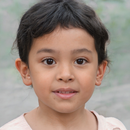 Joyful latino child female with short  brown hair and brown eyes