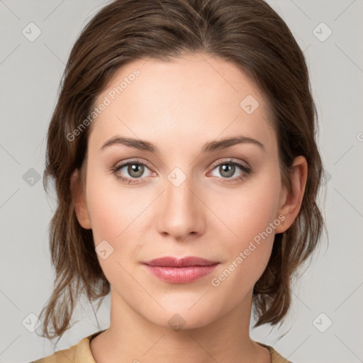 Joyful white young-adult female with medium  brown hair and green eyes