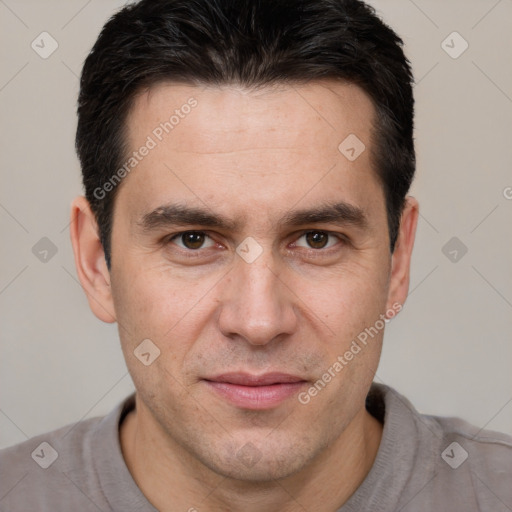 Joyful white adult male with short  brown hair and brown eyes