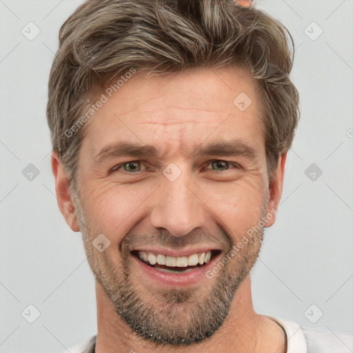 Joyful white adult male with short  brown hair and grey eyes