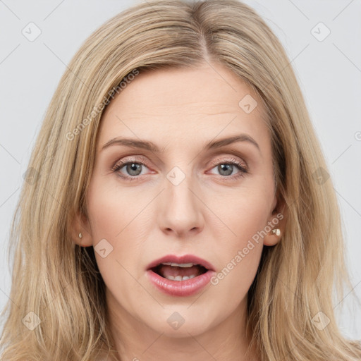 Joyful white young-adult female with long  brown hair and grey eyes