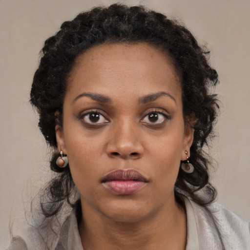 Neutral black young-adult female with medium  black hair and brown eyes