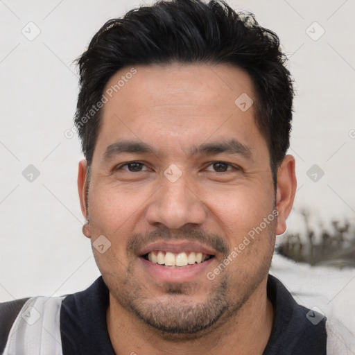 Joyful white young-adult male with short  black hair and brown eyes