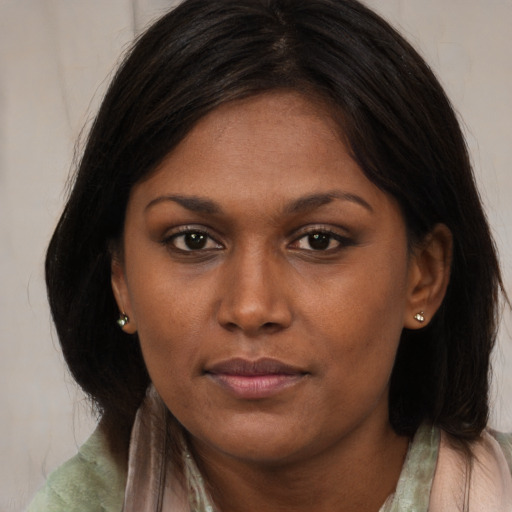 Neutral black young-adult female with long  brown hair and brown eyes
