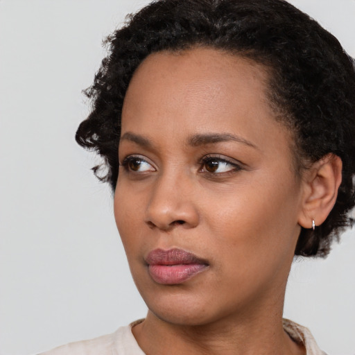 Neutral black young-adult female with short  black hair and brown eyes
