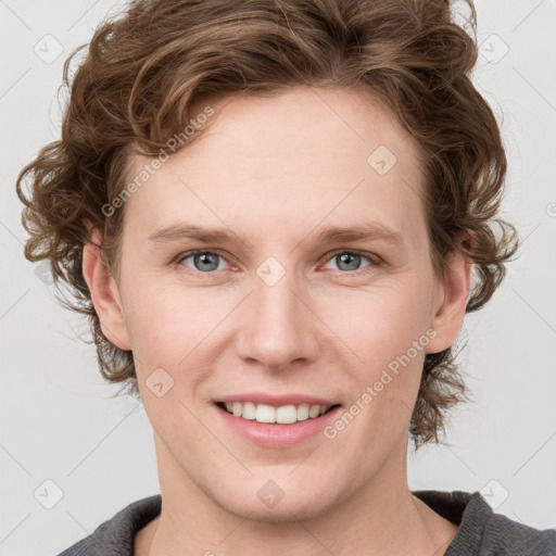 Joyful white young-adult female with medium  brown hair and blue eyes