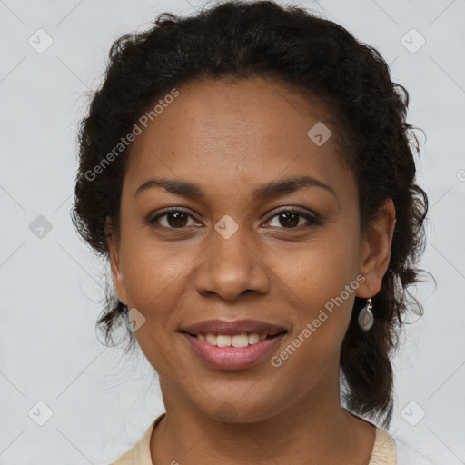 Joyful black young-adult female with medium  brown hair and brown eyes