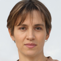 Joyful white adult female with short  brown hair and brown eyes