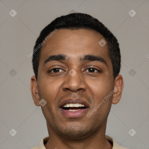 Joyful black young-adult male with short  black hair and brown eyes