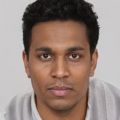 Neutral black young-adult male with short  brown hair and brown eyes