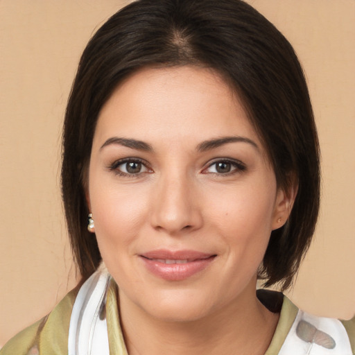 Joyful white young-adult female with medium  brown hair and brown eyes