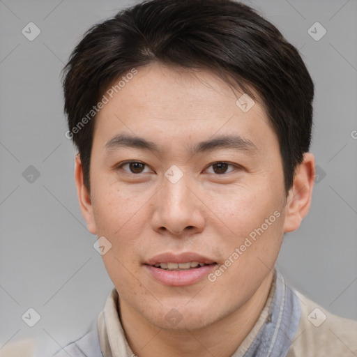Joyful asian young-adult male with short  brown hair and brown eyes