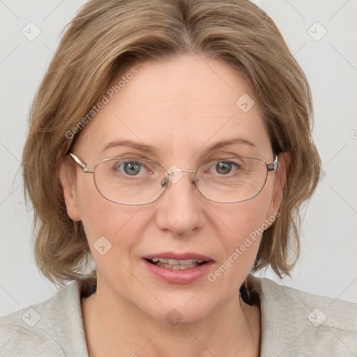 Joyful white adult female with medium  brown hair and blue eyes