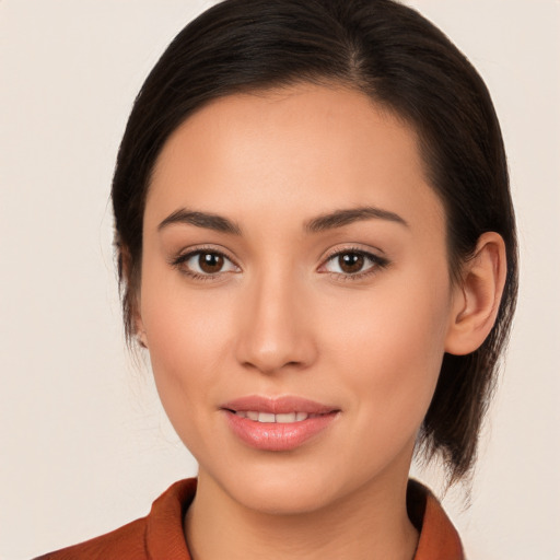 Joyful white young-adult female with medium  brown hair and brown eyes