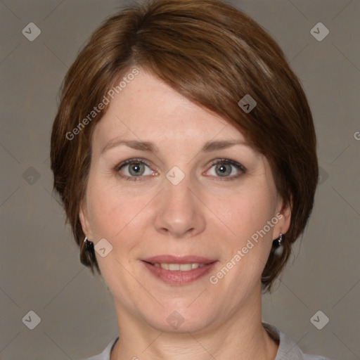 Joyful white adult female with medium  brown hair and grey eyes