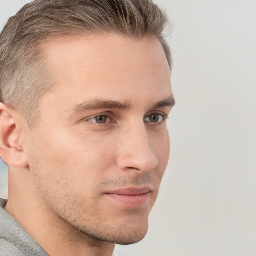 Neutral white young-adult male with short  brown hair and grey eyes