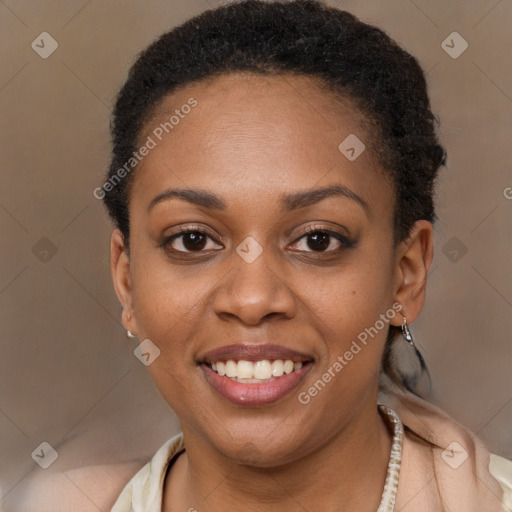 Joyful black young-adult female with short  brown hair and brown eyes