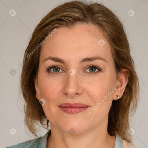 Joyful white adult female with medium  brown hair and grey eyes